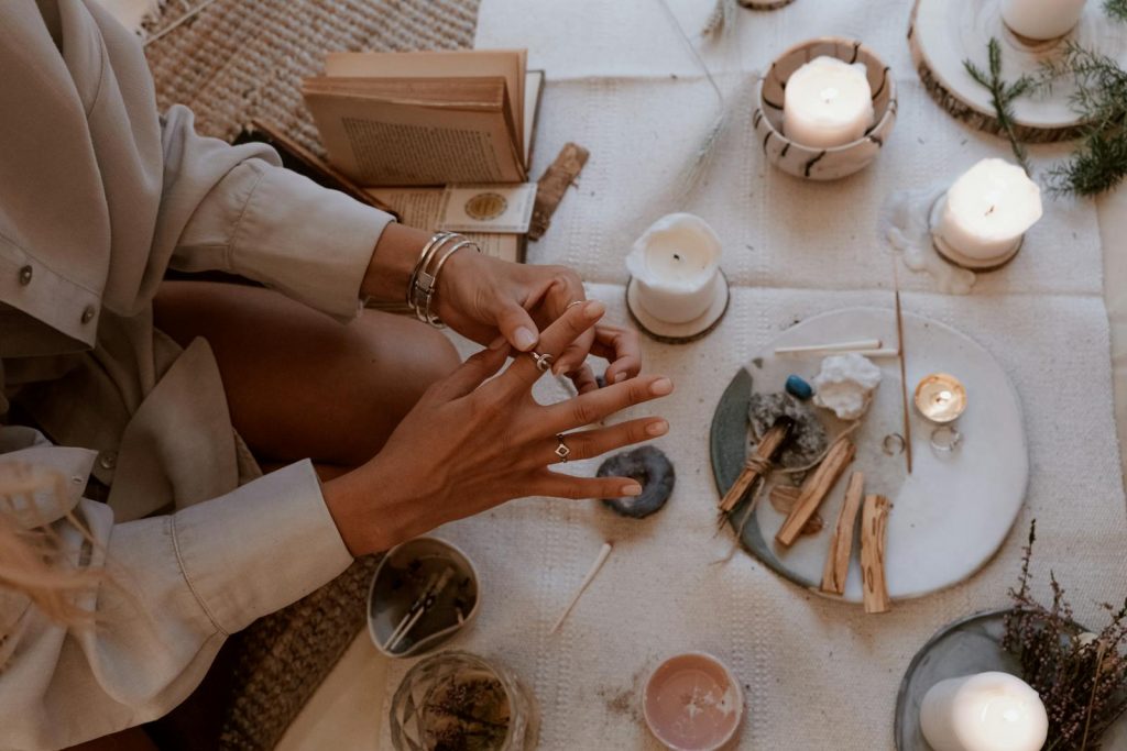 Overhead Shot of a Person's Hands Putting on a Ring - Sustainable Accessories