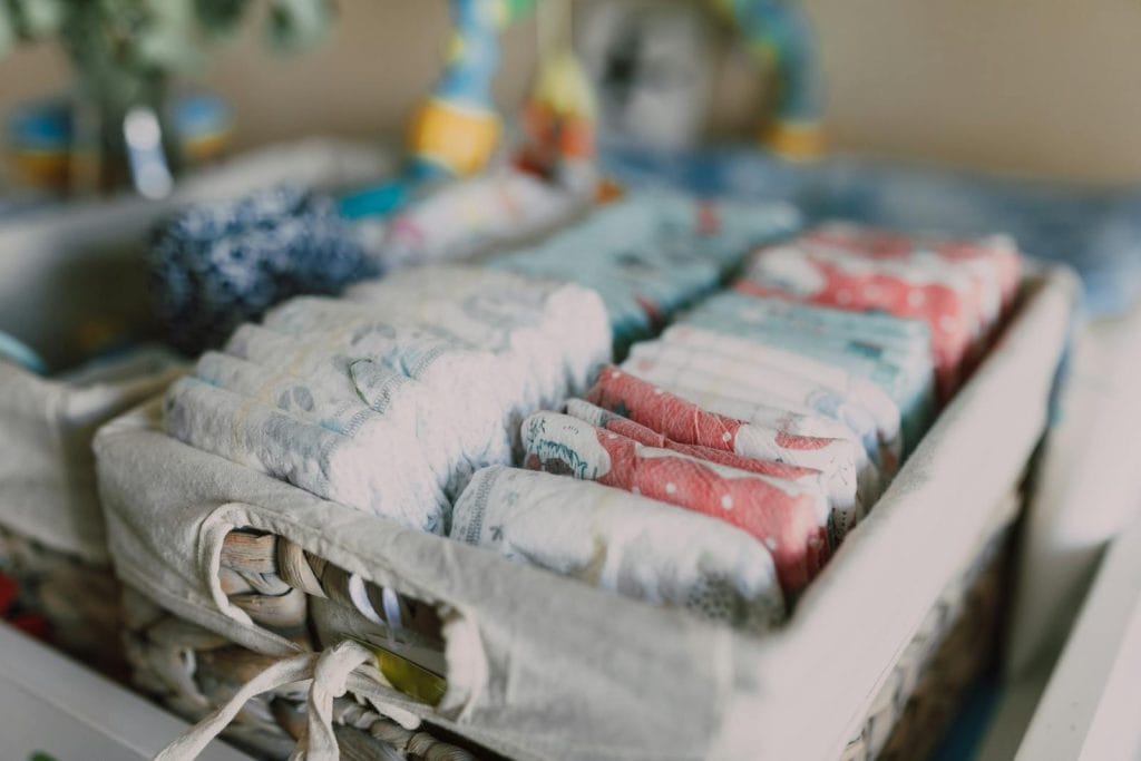 Organized Diapers on Woven Basket - Organic Diapers