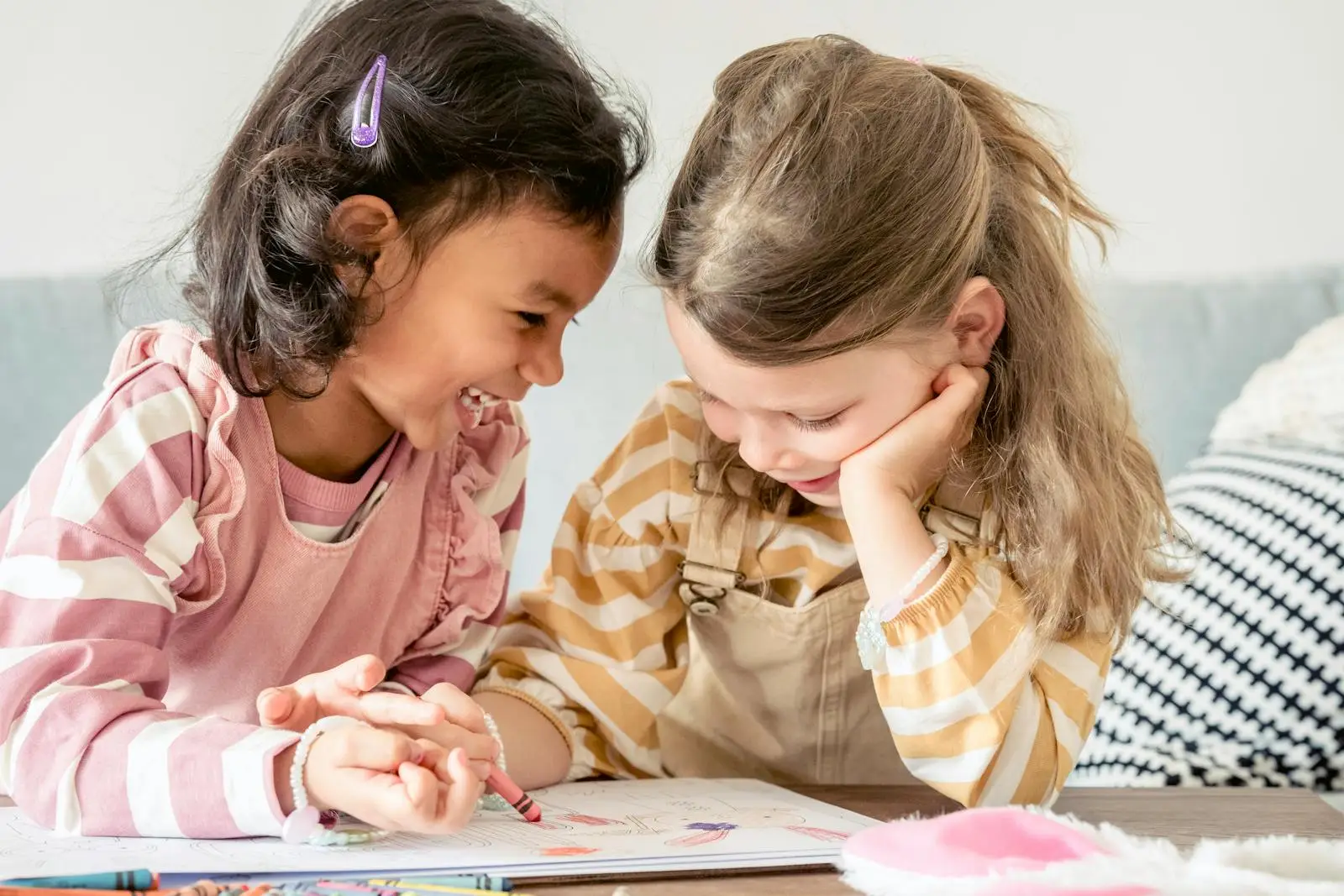 Happy diverse girls painting together - eco friendly activities